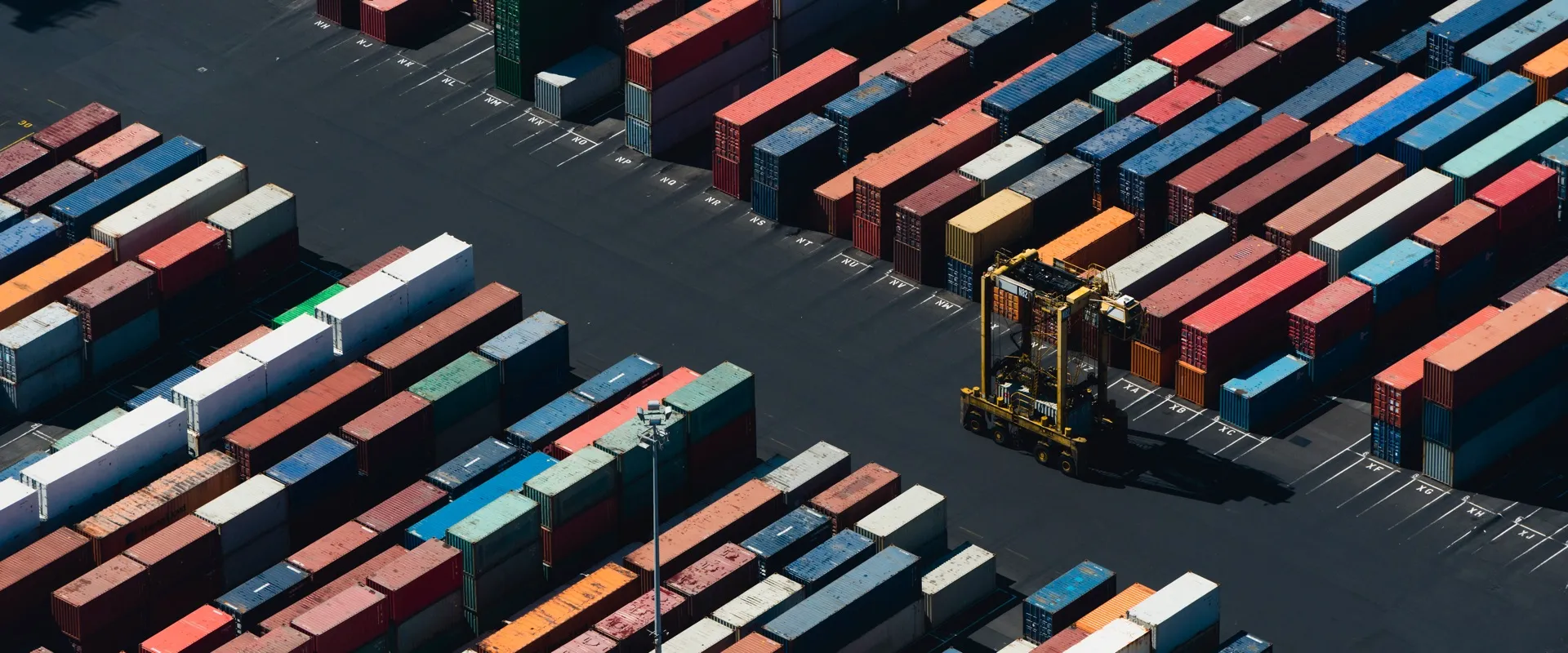 Aerial view of stacked cargo containers in a port