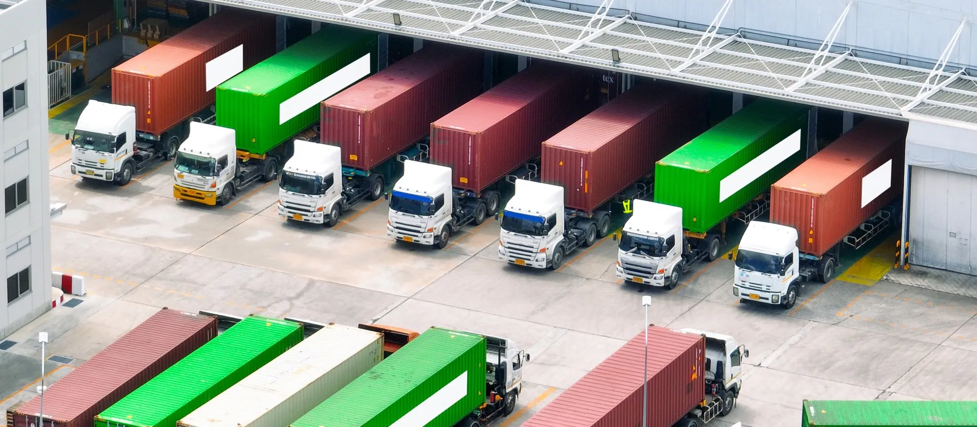 Freight trucks at a warehouse loading dock
