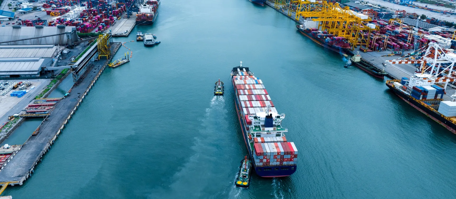 Shipyard with stacked freight containers at a sea port